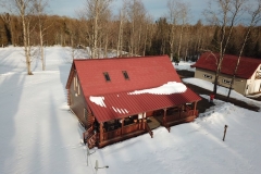 Rustic and Standing Seam Metal Roofing in Terra Red